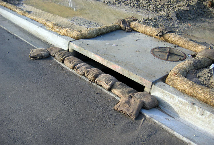 Storm drain inlet protection installed around a drain inlet